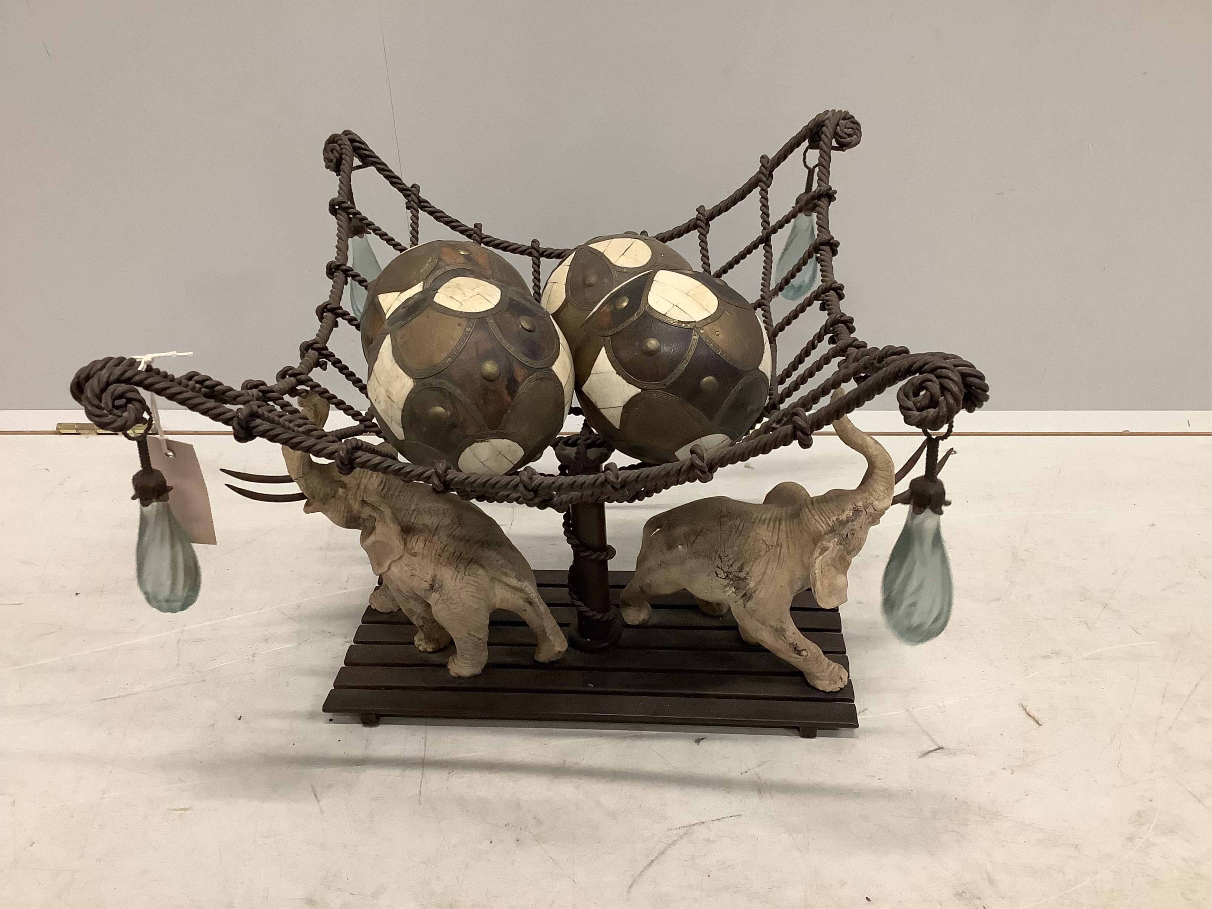 A Contemporary composition elephant and basket centrepiece, width 43cm, height 37cm. Condition - fair